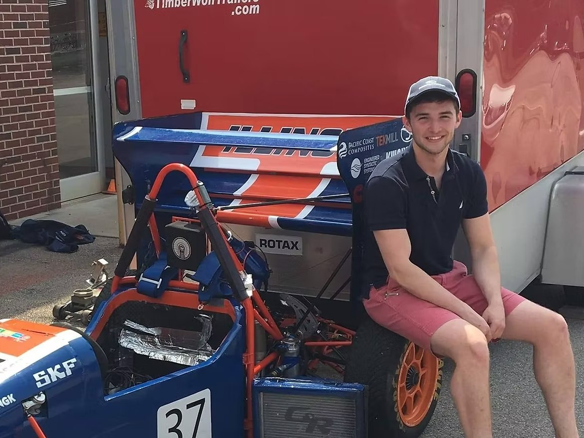 Stephen with the number 37 Formula SAE car at competition