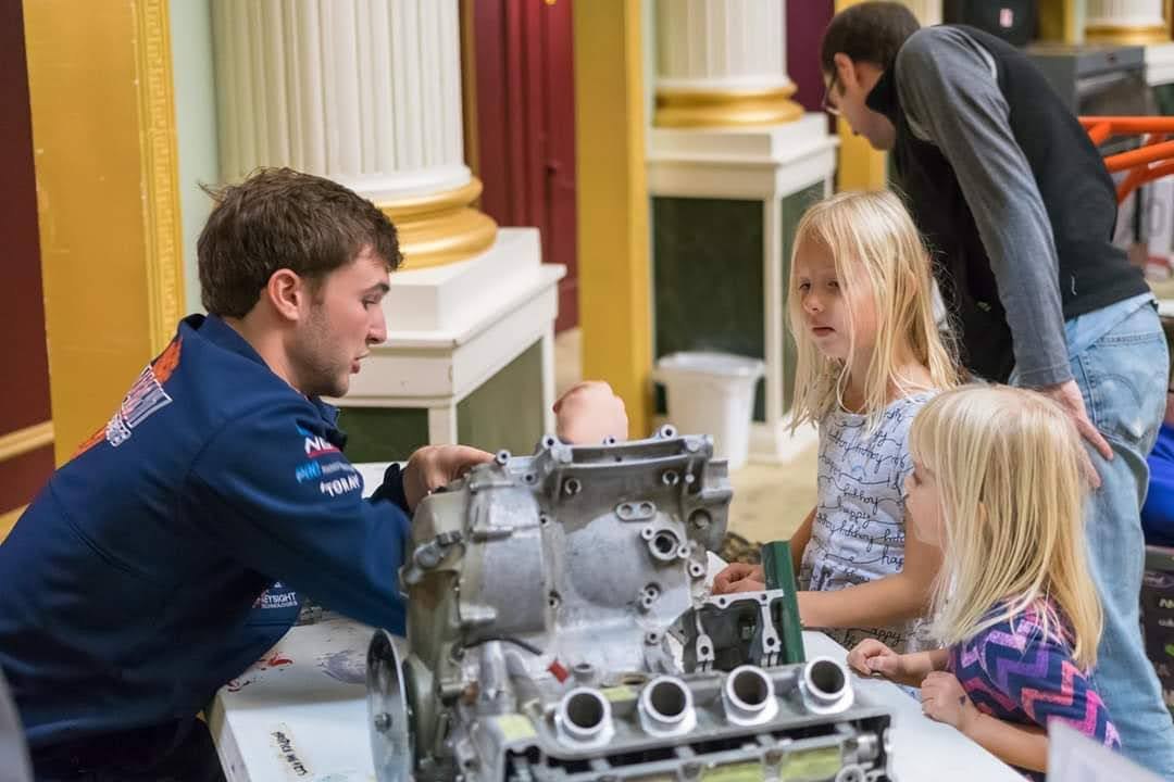 Stephen showing an engine to two young visitors at an outreach event