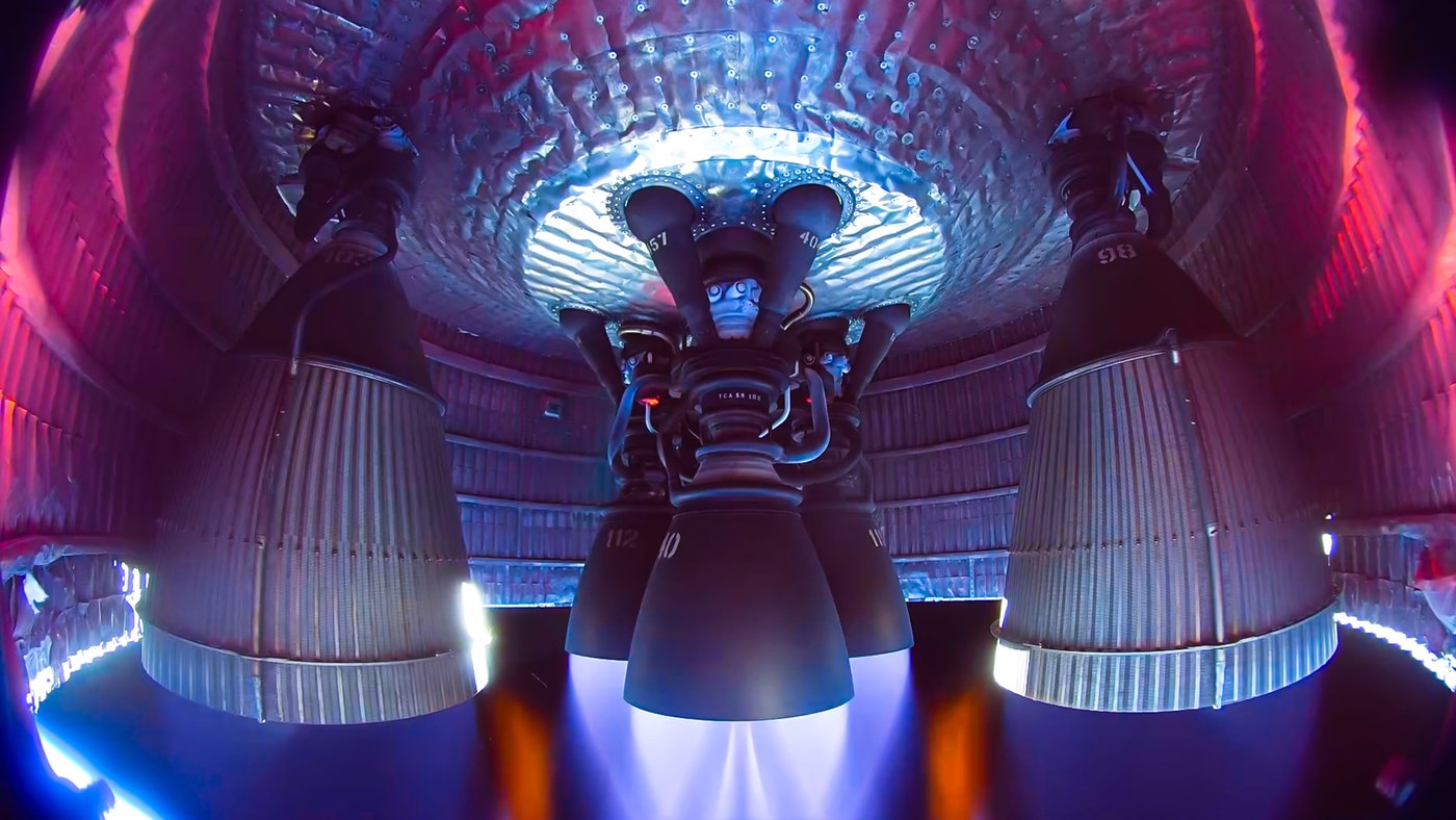 Raptor engines firing, seen from the engine skirt