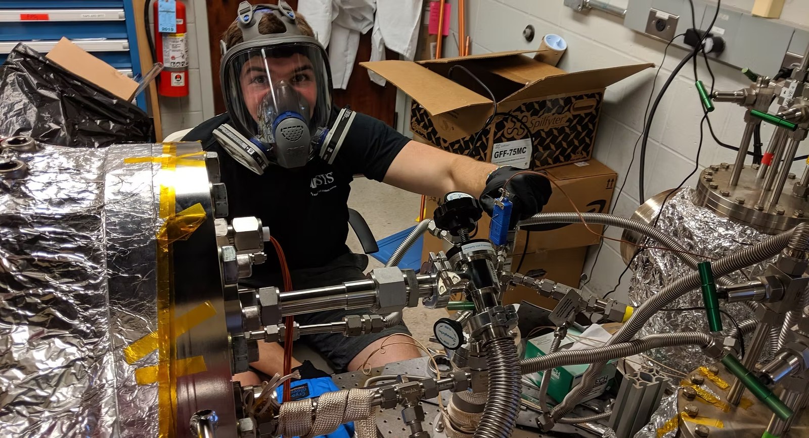 Working on a vacuum chamber in the lab
